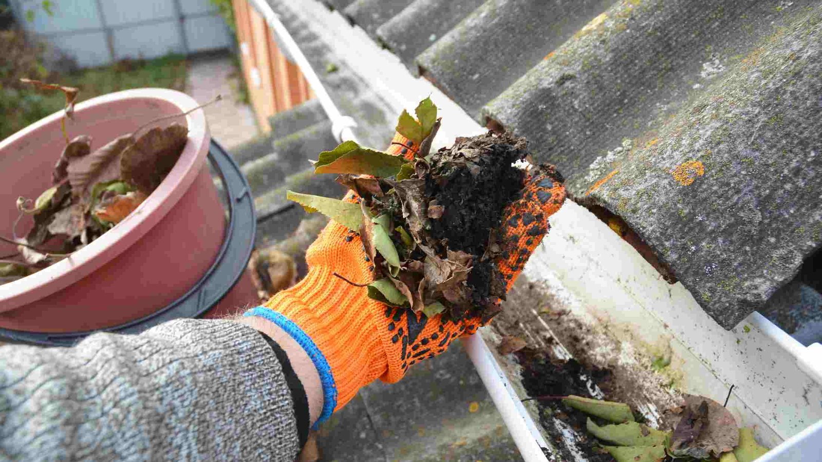 Gutter being cleaned out on a UK home
